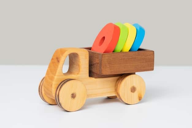 wooden toy truck with colored rings back grey background 182793 2637