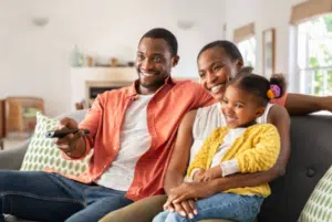 kids with parents watching tv